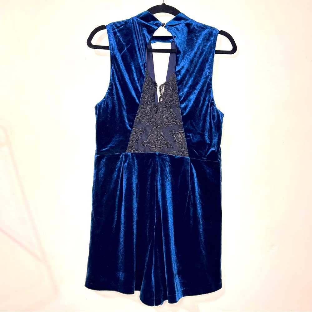 Regal Blue one piece romper, velvet with lace back
Size XL
NWOT